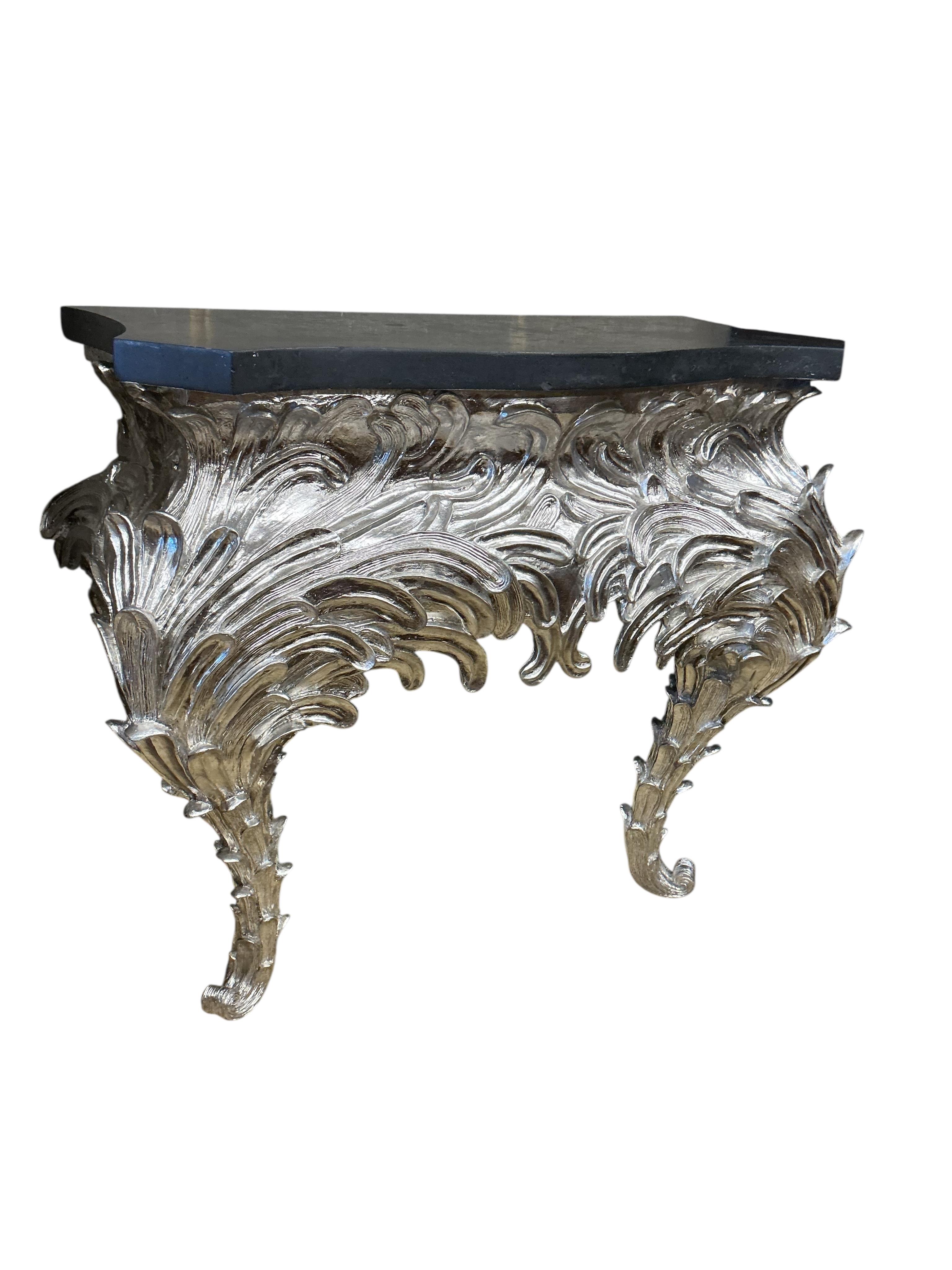 A pair of contemporary silvered composition serpentine 